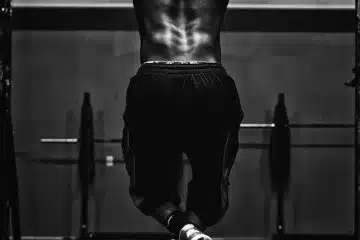 grayscale photo of man working out