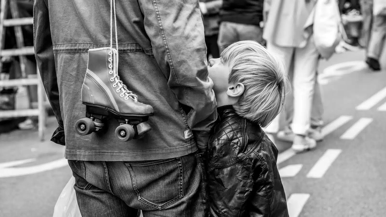 grayscale photo of boy in jacket